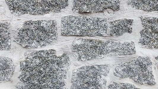 灰色石墙背景 石头的质地 古老的城堡墙背景 作为背景或纹理的石墙 墙壁的一部分 用于背景或纹理花岗岩岩石石工材料大理石水泥建筑学图片