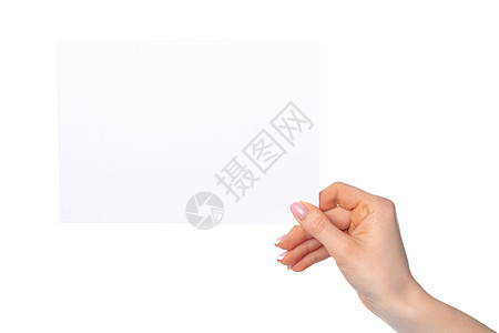 女性手握空白白纸的白纸 在白色上被孤立商业身份广告标签礼物手指角落成功卡片手臂图片