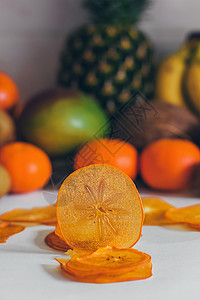 干自制健康新鲜脱水水果片 水果片 天然生素食有机零食 健康食品的概念 柿子饮食小吃收成水果橙子烹饪芯片团体筹码热带图片