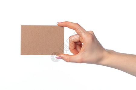 女性手上的手工纸纸卡 在白色上隔离品牌商业木头推广笔记包装小样问候语牛皮纸数据图片