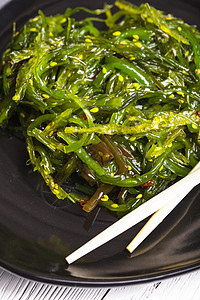 海藻沙拉饮食盘子食物杂草藻类螺旋蔬菜美味种子沙拉图片