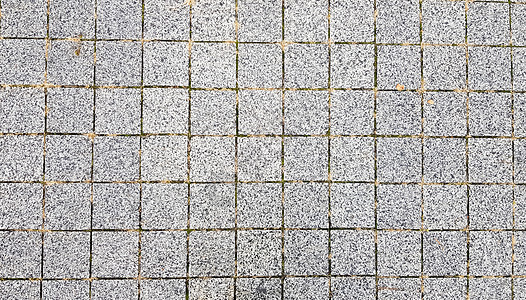 石头人行道 在城市老城区的道路和人行道上铺路石 铺路石材料背景 花岗岩 鹅卵石 背景的混凝土摊铺机地板模板大街材料石质城市灰色平图片