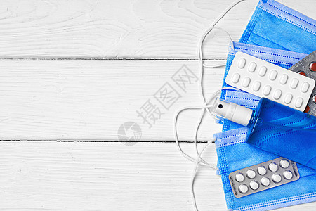 蓝色面罩 药丸和以木制背景的清洁凝胶预防病菌洗手液药品消毒发烧瓶子疾病消毒剂外科图片