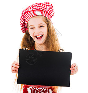 可爱的女孩拿着空白纸给你的短信厨房戏服横幅广告孩子食谱手势帽子快乐烹饪图片