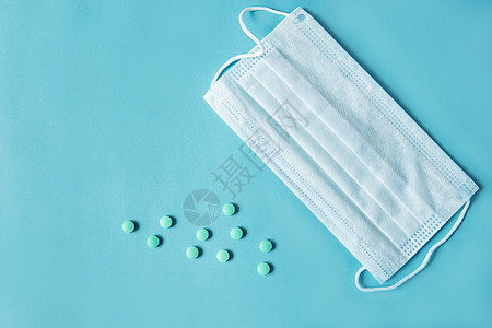 呼吸面具和蓝色底部胶囊里的药剂防腐剂流感口罩消毒液体防护预防物质背景消毒剂图片