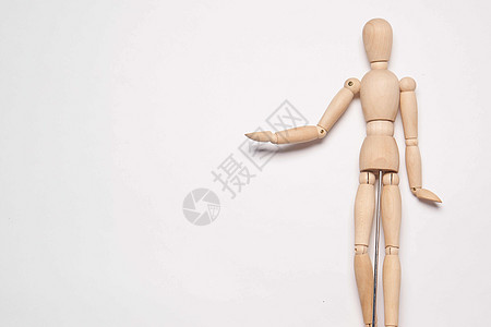 制造物体光背景的木制人造假人男性娃娃商业木偶白色玩具人体模型冒充身体图片