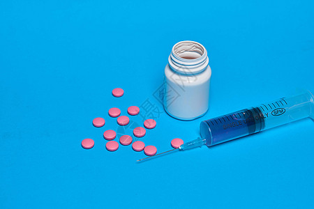 止痛药维生素胶囊医学蓝色背景帮助剂量红色处方治疗白色疼痛药品治愈科学图片