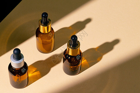 棕色玻璃罐 带管子的油润湿皮肤护肤品牌液体润肤洗剂身体产品肥皂芳香化妆品治疗图片