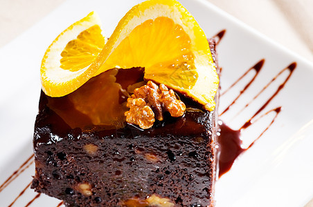 巧克力和胡桃蛋糕核桃烹饪食物奶油甜点小吃馅饼正方形橙子美食图片