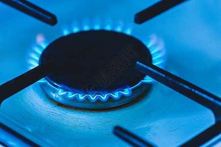 煤气炉炉子上放着蓝色火焰的煤气燃烧器 特制圆圈食物甲烷烤箱戒指燃料辉光丁烷烹饪炊具图片