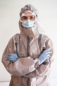 PPE 个人防护装备的女医生窗户手套医院房间保健安全感染外科预防眼镜图片