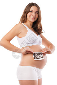 孕妇正在拍摄她超声波的图片扫描家庭肚子孩子子宫父母幸福身体成人腹部图片