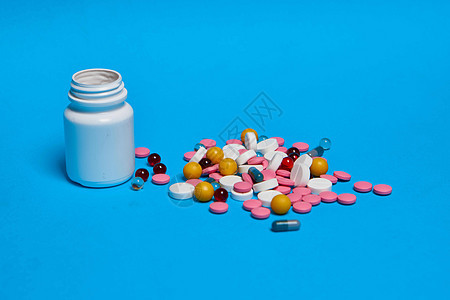 止痛药维生素胶囊医学蓝色背景化学品帮助宏观剂量制药疾病治疗药店抗生素疼痛图片