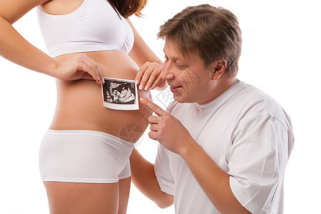 孕妇和丈夫持有超音速超声波腹部子宫幸福身体产妇成人母性胚胎母亲父亲图片