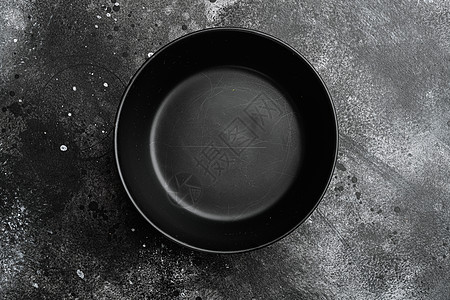 空黑碗 有文字或食物的复制空间 有文字或食物的复制空间 顶视图平躺 黑色深石桌背景制品桌子盘子石头陶瓷餐具圆形纹理图片