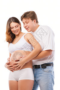 怀孕的年轻夫妇母亲和快乐的父亲母性男性肚子拥抱女士产妇身体父母女性生活图片