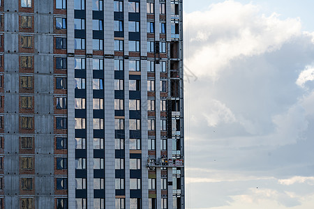 住宅公寓楼群的建筑建设勃起建设者房子建筑学城市工人蓝色地面天空工程图片