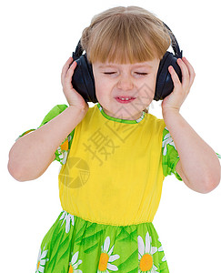 非常音乐的小女孩 玩得很开心 通过大黑耳机来听音乐吧 笑声小学生青春期幼儿园喜悦孩子幸福学生童年课堂学校图片