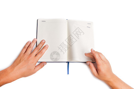 手握白纸的开放书的人日记商业男人笔记手指阅读笔记本空白桌子文档图片