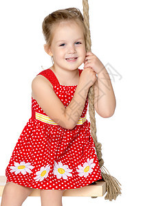 一个小女孩的近身肖像裙子孩子微笑衣服乐趣头发女儿童年发型女性图片