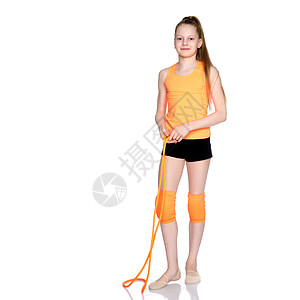 一名女体操运动员用跳绳练习女孩体操训练青年舞蹈家工作室健身房有氧运动运动姿势图片