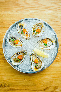 生生和新鲜牡蛎贝壳加柠檬生蚝熟食美食食物石头海鲜盘子贝类图片
