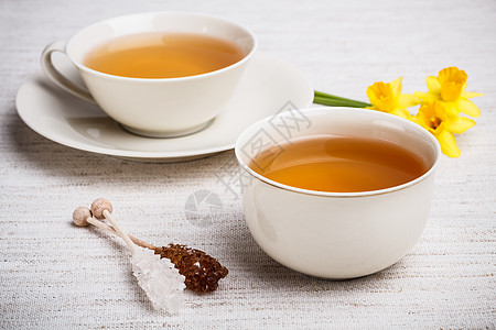 茶杯美食黄色液体水仙早餐帆布压痛糖棒季节水仙花图片