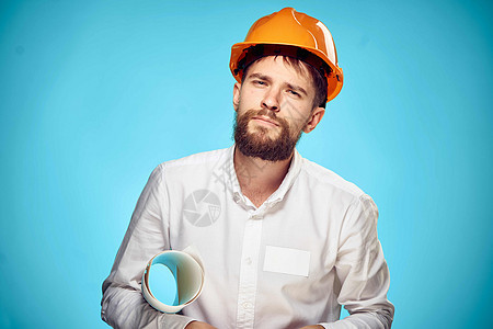 男子在橙色头盔建筑工程中的工作专业工程师成人领班工程经理男性工作室衣领数字安全商业图片