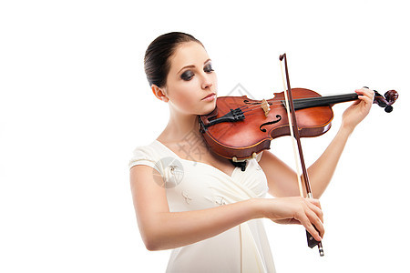 美丽的年轻女子在小提琴上打白音乐交响乐音乐家女孩女性乐器细绳学校音乐会成人图片
