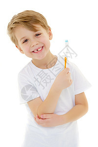 一个小男孩在用牙刷刷牙 刷牙牙科快乐乐趣孩子喜悦牙齿男性卫生男生刷子图片