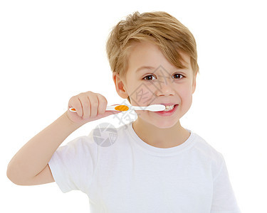 一个小男孩在用牙刷刷牙 刷牙牙齿刷子男性卫生牙膏打扫牙医健康保健微笑图片