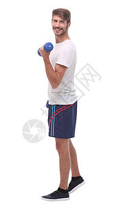 在全面成长中 有哑铃的年轻人运动白色预防精力重量男性肌肉运动员体操成人图片