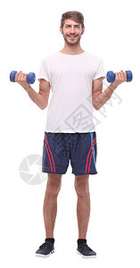 在全面成长中 有哑铃的年轻人健身房重量男性培训师训练精力运动员肌肉运动男人图片