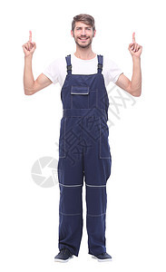 面带微笑的男人穿着蓝色工作服 指向复制空间连体衣机械男性工装裤安全维修商业手势工作室白色图片