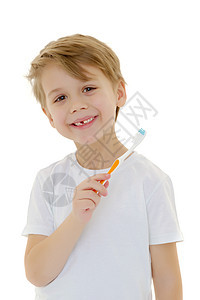 一个小男孩在用牙刷刷牙 刷牙孩子童年牙膏打扫刷子金发预防微笑男性保健图片