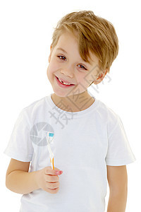 一个小男孩在用牙刷刷牙 刷牙快乐保健乐趣微笑卫生牙齿预防牙科打扫童年图片