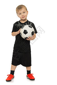 带足球球的小男孩运动员男生青年闲暇冒充乐趣工作室团队孩子们男性图片