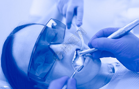 牙科队和牙医外科病人的牙科小组橡皮椅子面具保健诊断卫生医院照片牙科学医生图片