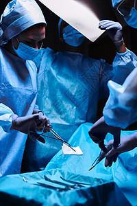 正在工作的小组外科医生团体卫生医院病人手术房间男人保健治疗医疗保险图片