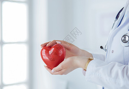 以轻度背景持有心脏心部听诊器的女医生援助诊断有氧运动护士治疗医院职业工人药品攻击图片