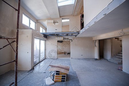 建筑工地内有脚手架梯子房子框架天花板商业装修住宅材料房间公寓背景图片