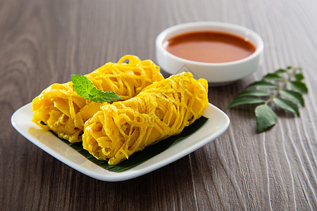 Roti Jala 马来西亚传统蛋糕网绉饼子花边马来语街道食物香料黄色小吃美味图片