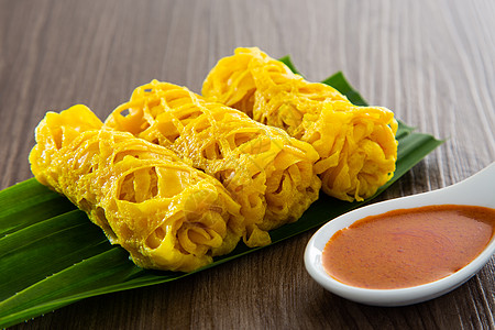 Roti Jala 马来西亚传统蛋糕羊肉马来语香料食物网绉小吃黄色饼子花边美味图片