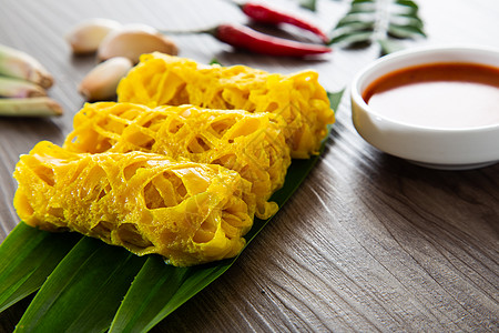 Roti Jala 马来西亚传统蛋糕饼子马来语香料黄色花边羊肉美味网绉小吃食物图片