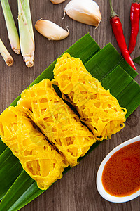 Roti Jala 马来西亚传统蛋糕羊肉小吃香料网绉饼子街道马来语食物美味黄色图片