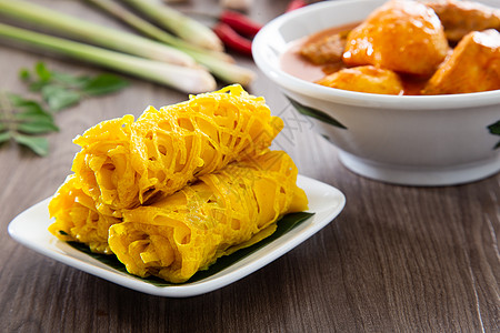 Roti Jala 马来西亚传统蛋糕羊肉网绉街道小吃马来语饼子美味花边黄色香料图片