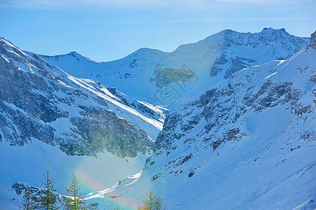 冬天下雪的高山高山运动冻结季节冰川风景顶峰天空爬坡蓝色首脑图片