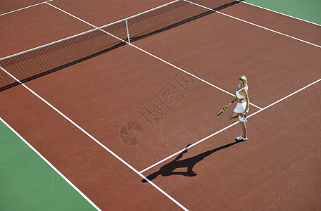 年轻妇女户外打网球爱好服务活动闲暇乐趣橙子运动玩家娱乐女性图片