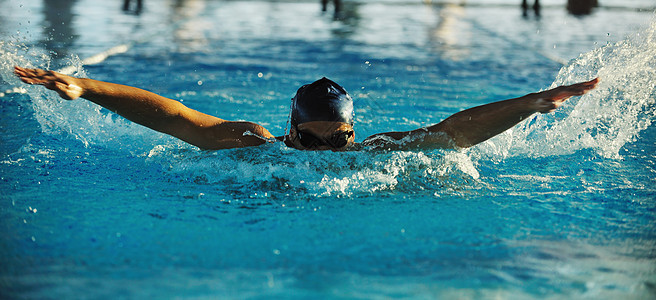 游泳运动员风镜速度水池男人活力青少年游泳衣娱乐行动海浪背景图片