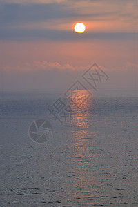 海滩日落日光天空冲浪太阳橙子天际阳光蓝天气氛晴天图片